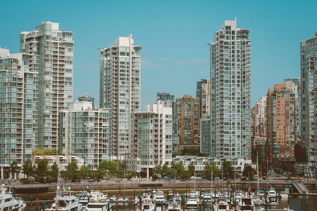 high rise architectural photography of white building urban